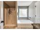Bright bathroom with a shower over tub and a jet tub at 1006 Chambers Rd, York, SC 29745