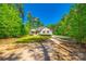 Quaint home's exterior elevation featuring a well-maintained yard and nestled amongst tall trees at 1006 Chambers Rd, York, SC 29745