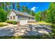 View of home's driveway and garage showing ample parking and an attached two car garage at 1006 Chambers Rd, York, SC 29745