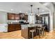 Modern kitchen features stainless steel appliances, granite countertops, island with seating, and wooden cabinets at 1006 Chambers Rd, York, SC 29745