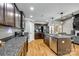 Bright kitchen featuring granite countertops, stainless steel appliances, wooden cabinetry, and hardwood floors at 1006 Chambers Rd, York, SC 29745