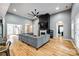 Spacious living room features fireplace, large sectional sofa, hardwood flooring and arched entryways at 1006 Chambers Rd, York, SC 29745