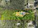 Aerial view showing home's expansive lot lines surrounded by dense, mature trees, offering privacy at 1006 Chambers Rd, York, SC 29745