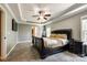 Main bedroom featuring a tray ceiling, ceiling fan, and two large windows at 1006 Chambers Rd, York, SC 29745