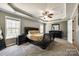Spacious main bedroom with a tray ceiling, carpet, and a ceiling fan at 1006 Chambers Rd, York, SC 29745