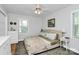 Bright bedroom features hardwood floors, a ceiling fan, and lots of natural light at 1024 Regency Dr, Charlotte, NC 28211