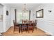 Elegant dining room with hardwood floors, chandelier, and classic wainscoting at 1024 Regency Dr, Charlotte, NC 28211