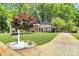 Inviting brick home with a well-maintained lawn, complemented by a decorative mailbox at 1024 Regency Dr, Charlotte, NC 28211