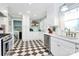Charming kitchen with black and white checkered floors and white cabinetry at 1024 Regency Dr, Charlotte, NC 28211