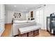 Bright living room with hardwood floors, sofa, bench with storage, and abundant natural light at 1024 Regency Dr, Charlotte, NC 28211