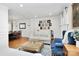 Open living room flowing into dining room, featuring hardwood floors and elegant decor at 1024 Regency Dr, Charlotte, NC 28211