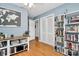 Office with hardwood floors, shelving units, and closet space at 1024 Regency Dr, Charlotte, NC 28211