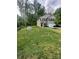 Charming two-story home with a well-manicured lawn, black shutters, and an attached garage at 1070 Glenbriar Ct, Woodleaf, NC 27054