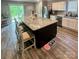 Open kitchen design featuring a large island, stainless appliances, and great natural light at 1070 Glenbriar Ct, Woodleaf, NC 27054