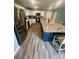 Modern kitchen featuring granite countertops, stainless steel appliances, and a center island at 1070 Glenbriar Ct, Woodleaf, NC 27054