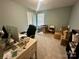 Functional office space with a large desk, a comfortable chair, and plenty of storage at 1070 Glenbriar Ct, Woodleaf, NC 27054