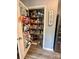 Walk-in pantry featuring organized shelving and ample storage for all your kitchen essentials at 1070 Glenbriar Ct, Woodleaf, NC 27054