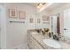 Bathroom with double sink vanity, granite counters, framed art, and decor at 11062 Discovery Nw Dr, Concord, NC 28027