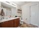 Bathroom with double sink vanity, floral shower curtain, decorative shelves, and tiled floors at 118 Maplecrest Dr, Kings Mountain, NC 28086