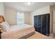 Bedroom with a bed, black wardrobe, neutral walls, carpet flooring, and window at 118 Maplecrest Dr, Kings Mountain, NC 28086