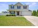 Charming two-story home with a well-maintained lawn and a two-car garage at 118 Maplecrest Dr, Kings Mountain, NC 28086