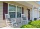 Inviting front porch with rocking chairs and decorative details at 118 Maplecrest Dr, Kings Mountain, NC 28086