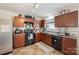 The modern kitchen features dark wood cabinets and stainless steel appliances at 118 Maplecrest Dr, Kings Mountain, NC 28086
