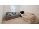 Cozy living room with a plush gray sofa, decorative pillows, and soft carpet at 118 Maplecrest Dr, Kings Mountain, NC 28086