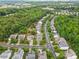 Bird's-eye view of a residential area boasting tree-lined streets, well-kept lawns, and a harmonious blend of homes at 12604 Congregation Dr, Charlotte, NC 28278