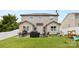 A spacious backyard featuring a patio with outdoor furniture, a grill, and a play set, perfect for entertaining and relaxation at 12604 Congregation Dr, Charlotte, NC 28278