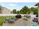 Backyard featuring a patio with furniture, a grill, a white fence, and toys at 12604 Congregation Dr, Charlotte, NC 28278