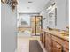Bright bathroom with double vanity, garden tub, and stand alone shower with natural light at 12604 Congregation Dr, Charlotte, NC 28278