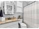 Neutral bathroom featuring granite vanity, toilet and tub with shower at 12604 Congregation Dr, Charlotte, NC 28278