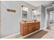 Spacious bathroom featuring granite countertops, double sinks and tiled floors plus natural lighting at 12604 Congregation Dr, Charlotte, NC 28278