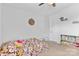 Comfortable bedroom with floral bedding, storage shelves, and carpeted floors at 12604 Congregation Dr, Charlotte, NC 28278