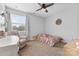 Bright bedroom featuring a window, carpeting, and a cozy armchair at 12604 Congregation Dr, Charlotte, NC 28278