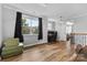 Spacious bonus room with hardwood floors, two windows, and a view of the outdoors at 12604 Congregation Dr, Charlotte, NC 28278