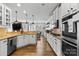 Spacious kitchen with stainless steel appliances, granite countertops, and views of the dining area at 12604 Congregation Dr, Charlotte, NC 28278