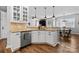 Beautiful kitchen with white cabinets, stainless steel appliances, and view to dining area at 12604 Congregation Dr, Charlotte, NC 28278