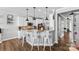 Open kitchen featuring an island with bar seating and pendant lighting at 12604 Congregation Dr, Charlotte, NC 28278