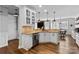 Open concept kitchen with granite counters, white cabinets, and modern stainless steel appliances at 12604 Congregation Dr, Charlotte, NC 28278