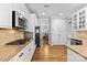 Well-equipped kitchen featuring stainless steel appliances, tile backsplash, and ample storage at 12604 Congregation Dr, Charlotte, NC 28278