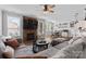 Cozy living room featuring a fireplace, large windows, and comfortable seating at 12604 Congregation Dr, Charlotte, NC 28278