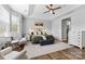 Bright and airy main bedroom features a ceiling fan, a bed with nightstands, and lots of natural light at 12604 Congregation Dr, Charlotte, NC 28278