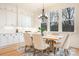 The dining room showcases a modern chandelier and views of the backyard at 131 High Lake Dr, Statesville, NC 28677