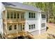 Rear exterior view features two levels of decks perfect for outdoor entertaining and relaxation at 131 High Lake Dr, Statesville, NC 28677