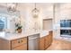 Bright kitchen with stainless steel appliances, farmhouse sink and white quartz countertops at 131 High Lake Dr, Statesville, NC 28677