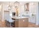 Modern kitchen with a large island, stylish lighting, and stainless steel appliances at 131 High Lake Dr, Statesville, NC 28677