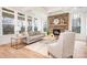 Bright living room featuring a stone fireplace, hardwood floors, and lots of natural light at 131 High Lake Dr, Statesville, NC 28677