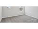 This bedroom has neutral colors, carpet and trim at 139 Satchel Ct, Mooresville, NC 28115